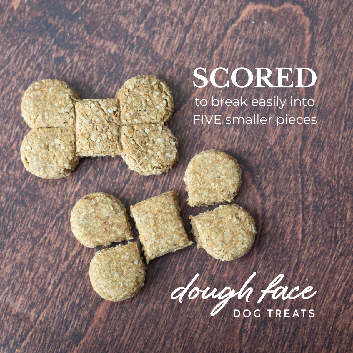 Two bone shaped dog treats on a wood textured background. One treat is intact, the other is broken into five pieces. The words "SCORED to break easily into FIVE smaller pieces" are in the top right hand corner and "dough face DOG TREATS" in the bottom right hand corner.