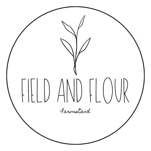 A circular black-and-white logo or label design with a simple leaf illustration above the words “FIELD AND FLOUR” and smaller text “Farmatand” underneath, on a white background.