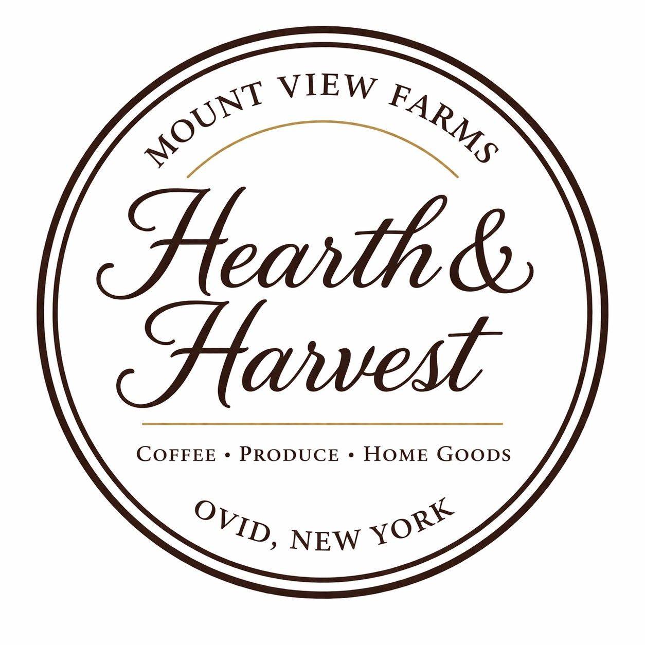 A circular logo for Mount View Farms Hearth & Harvest, featuring elegant dark brown typography and thin gold accent lines on a white background.