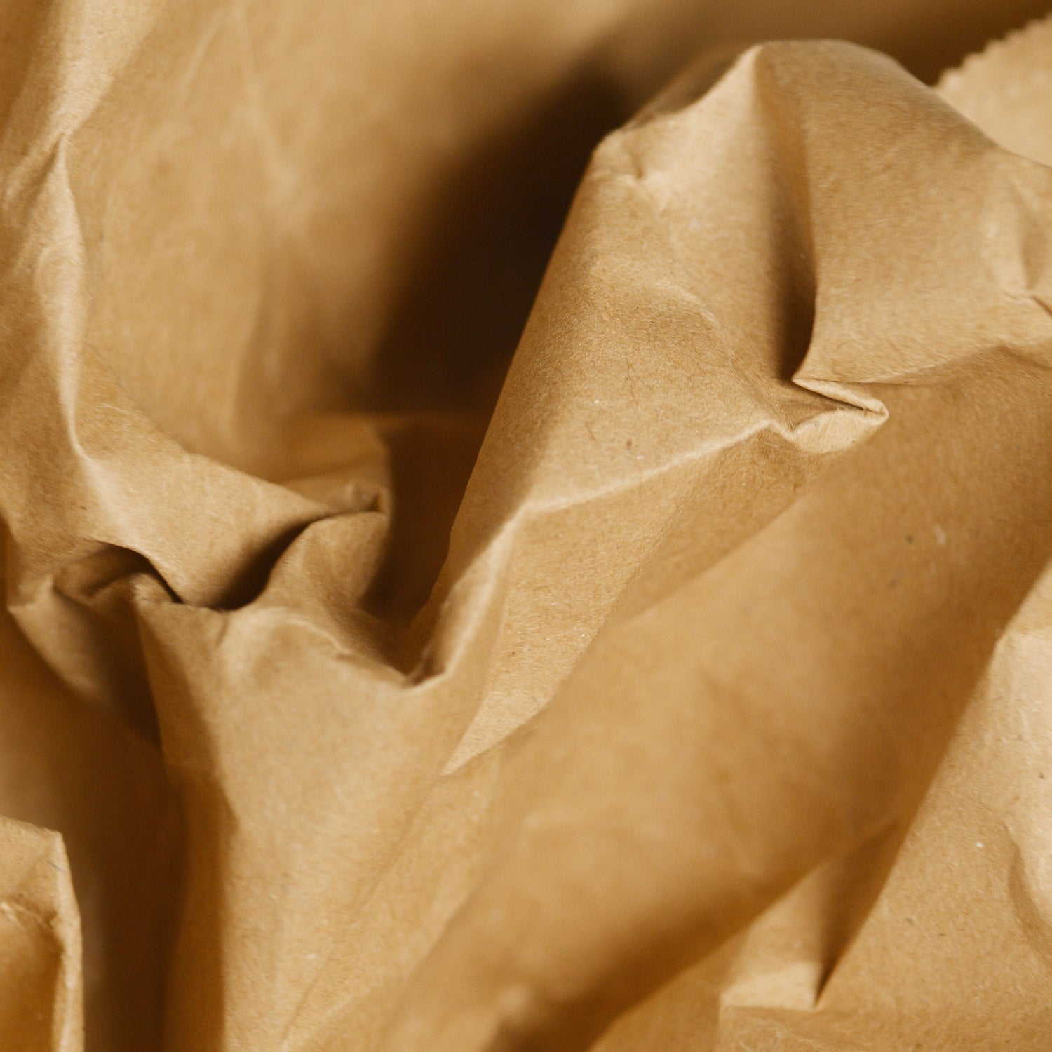Close-up of brown paper with folds