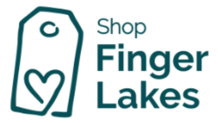 A teal graphic tag icon with a heart on the left and the words 'Shop Finger Lakes' in teal on a white background.